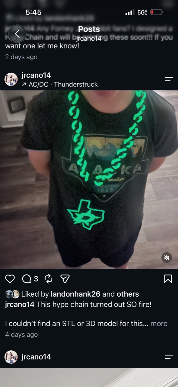 Justin’s bright green chain with a Texas-shaped star pendant, shown worn over a black shirt.